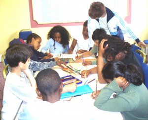 Photograph of children writing together